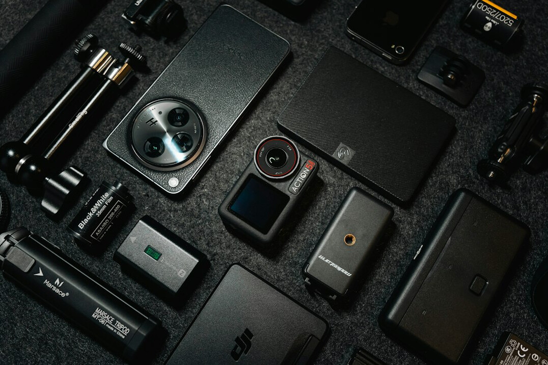 Flat lay of filmmaking equipment including camera, lenses and audio recorder